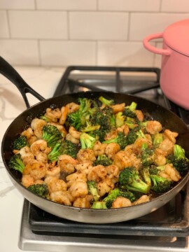 Asian Shrimp and Broccoli Stir-fry in a skillet on the stove