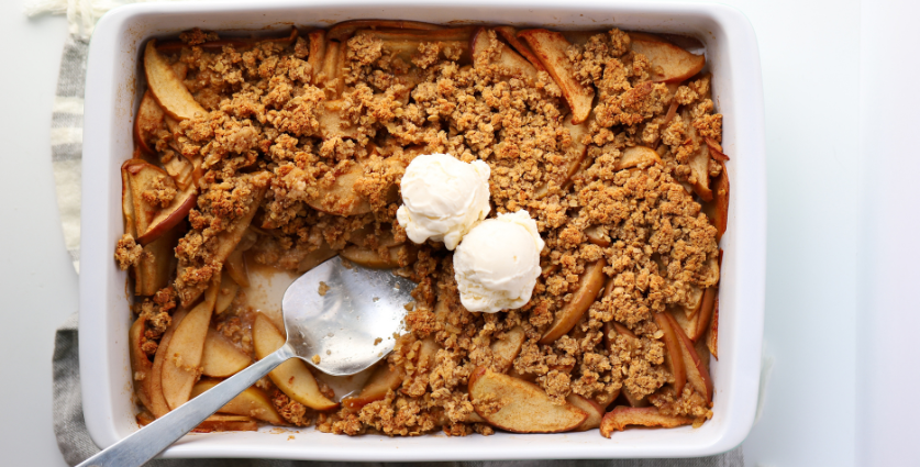 apple crumble in a white baking dish