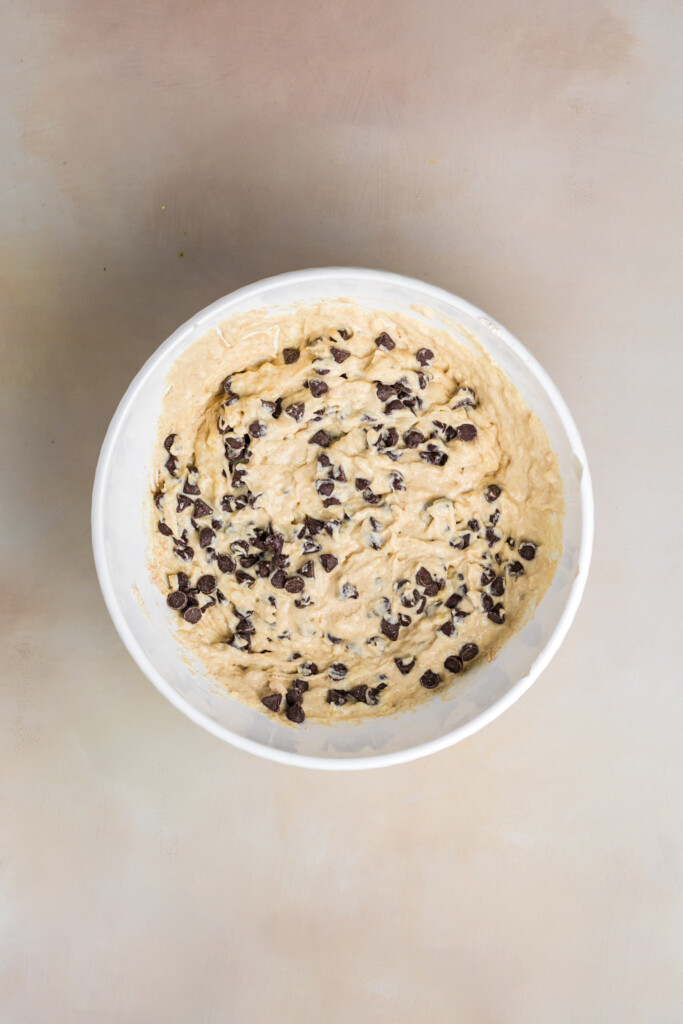 Banana chocolate chip protein pastry batter folded with chocolate chips.