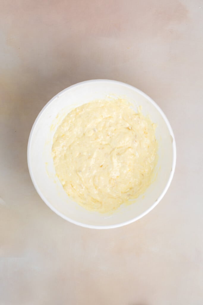 Smooth banana protein pastry batter mixed together in a white bowl.