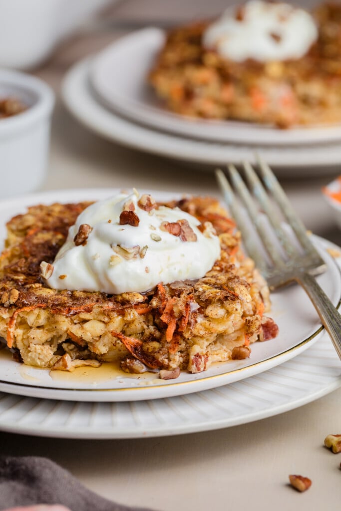 Warm carrot cake baked oatmeal drizzled with syrup and finished with a cream cheese dollop.